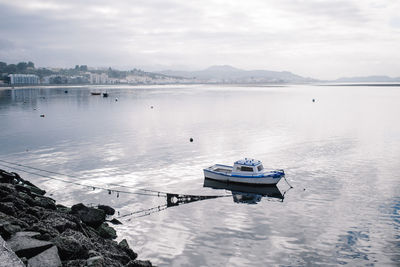 High angle view of boat moored on river against sky