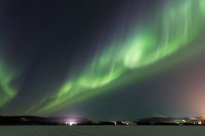 Scenic view of sea against sky at night