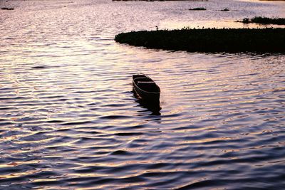 High angle view of boat on lake during sunset