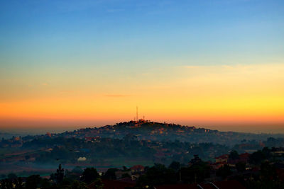 Silhouette of city during sunset