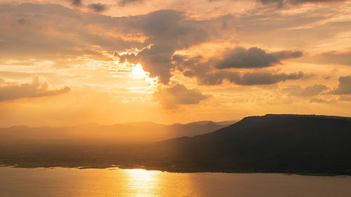 Scenic view of silhouette mountains against sky during sunset