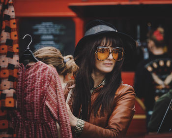 Portrait of young woman wearing sunglasses