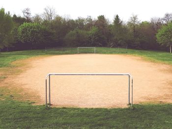 View of soccer field against trees