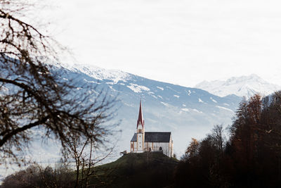 Building against sky during winter