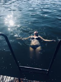 High angle view of woman swimming in pool