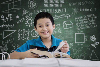 Boy studying at table