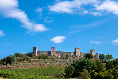 Skyline of little medieval town of monteriggioni, tuscany, against blue sky