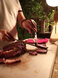 Midsection of woman preparing food on table