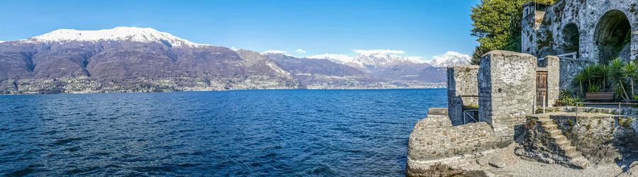 Extra wide view of the lake of como from the beach of corenno