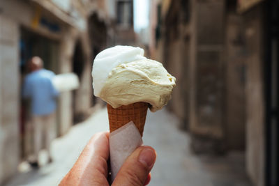 Cropped hand holding ice cream