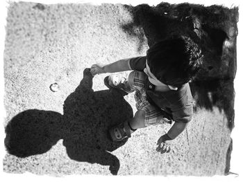 High angle view of boy on sand