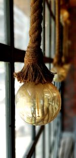 Close-up of rope tied to window
