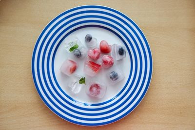 High angle view of fruits in plate on table