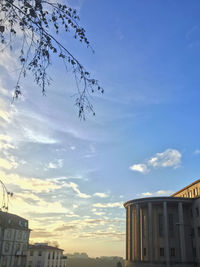 Low angle view of building against cloudy sky