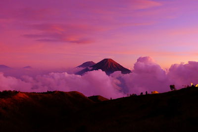 Scenic view of silhouette mountain against sky during sunset