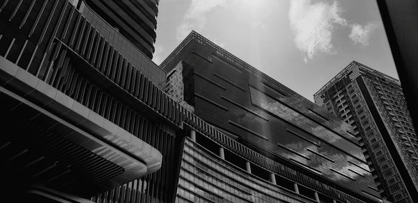 Low angle view of modern buildings against sky