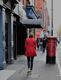 Rear view of woman walking in city