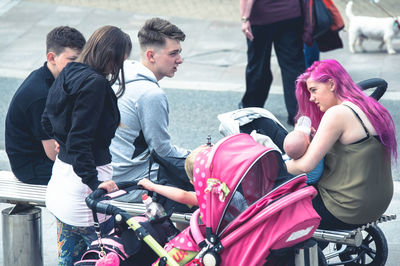 Rear view of people on bicycle