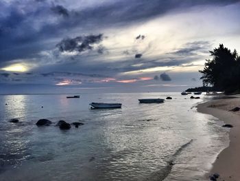 Scenic view of sea against cloudy sky