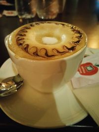 Close-up of cappuccino on table