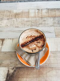 High angle view of coffee cup on table