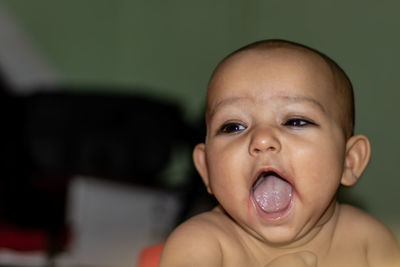 Baby infant cute innocent facial expression with blurred background