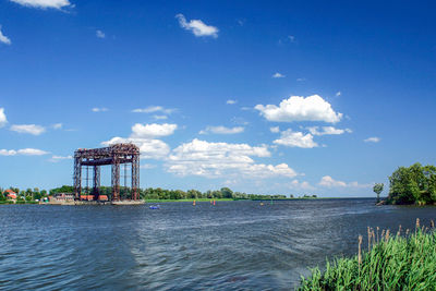 Scenic view of sea against blue sky
