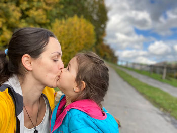 Portrait of mother and daughter outdoors