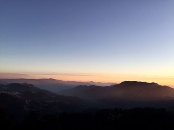 Scenic view of mountains at sunset