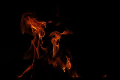 Close-up of bonfire against black background