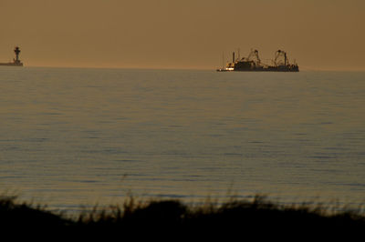 Scenic view of sea at sunset