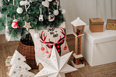 Beautiful christmas decoration at home, christmas tree, gifts and ornaments
