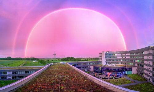 Rainbow over built structure