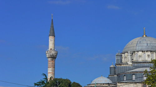 Low angle view of building against clear blue sky