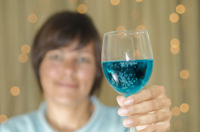 Close-up of drink held by woman