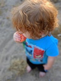 High angle view of boy eating food