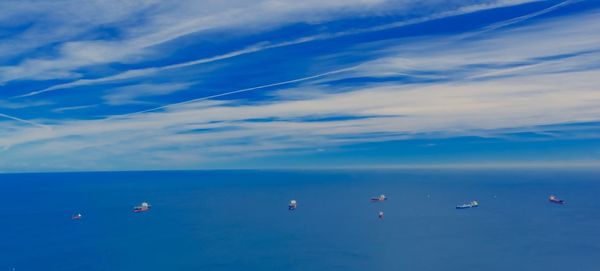 Scenic view of sea against blue sky