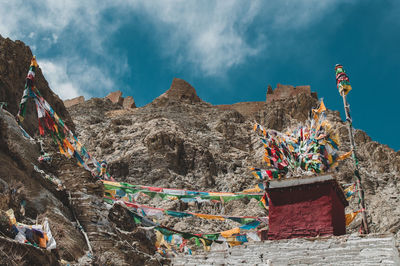 Low angle view of multi colored rocks against sky