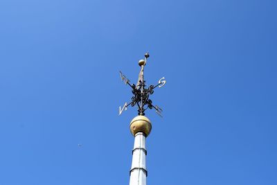 Low angle view of statue against blue sky