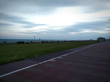 Scenic view of landscape against cloudy sky