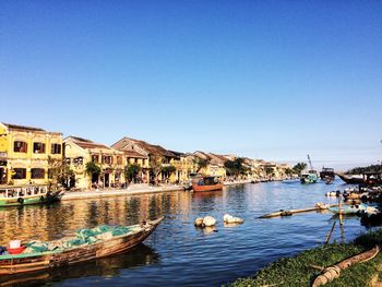 Boats moored at harbor