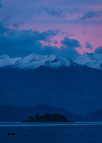 Scenic view of snowcapped mountains against sky during winter