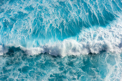 Beautiful sea waves with foam of blue and turquoise in bali,indonesia