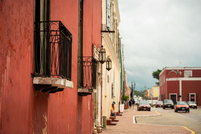 Street amidst buildings against sky