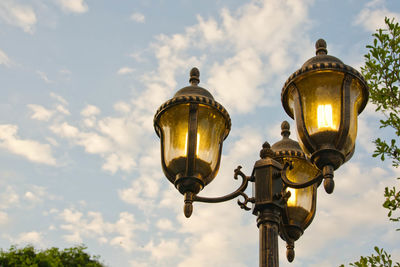 Low angle view of street light against sky