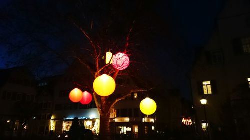 Low angle view of illuminated street light at night