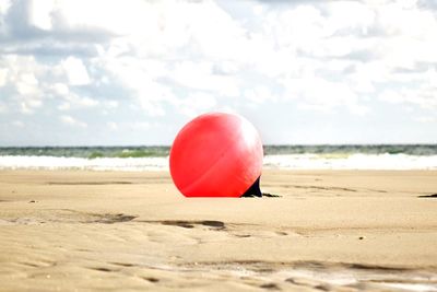 Red umbrella on beach