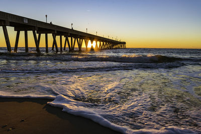 Scenic view of sea against clear sky during sunset