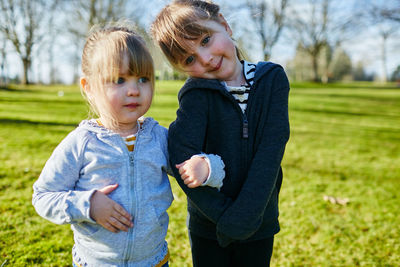 Boy and woman looking at grass