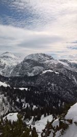 Scenic view of snow covered mountains against sky